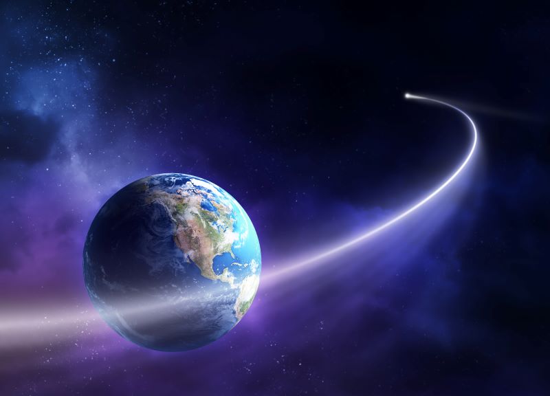 An image of earth taken from space with a hazy purple background and a bright white celestial object orbiting the planet. This is meant to symbolize sci-fi author J. L. Stowers’ desire to continue to follow her dreams and write science fiction for decades to come.
